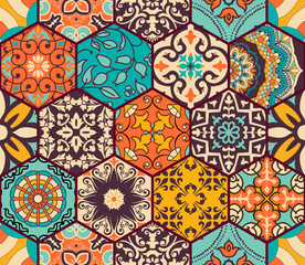 Seamless colorful patchwork tile with Islam, Arabic, Indian, Ottoman motifs. Majolica pottery tile. Portuguese and Spain decor. Azulejo. Ceramic tile in talavera style. Boho pattern