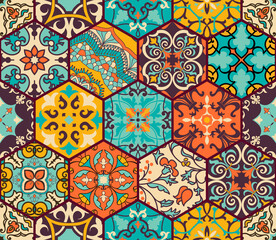Seamless colorful patchwork tile with Islam, Arabic, Indian, Ottoman motifs. Majolica pottery tile. Portuguese and Spain decor. Azulejo. Ceramic tile in talavera style. Boho pattern
