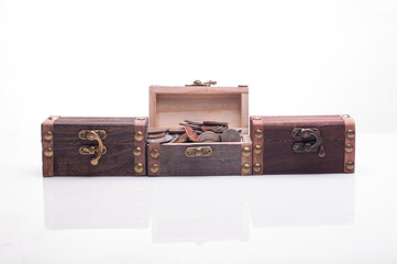 Set of miniature treasure chests isolated over white