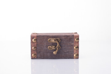 A miniature treasure chest isolated over white