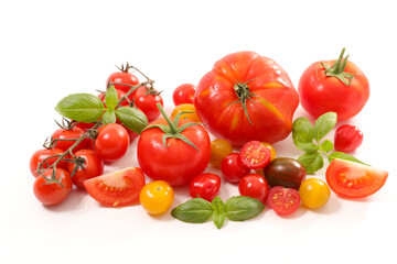 assorted of colorful variety of tomatoes and basil