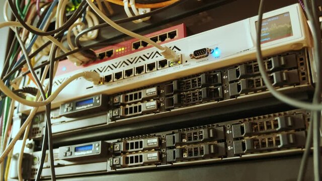 Network switch and ethernet cable in rack cabinet. Network connection technology and has a status LED to show working status. Concept of infrastructure with cables connected to data center