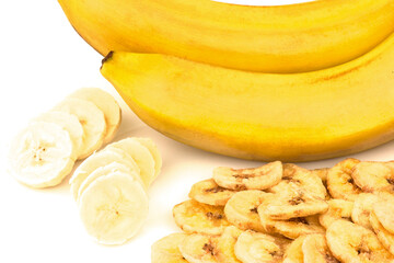 Heap of dried banana chips with banana cluster