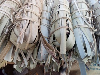 Jaggery sweet keeping in old style palm leaf barel ,Kerala India .