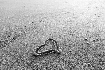 Love heart on beach romantic emotion on nature background.