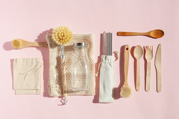 zero waste eco friendly cleaning kitchen concept. wooden brushes, drinking straw, cotton bags