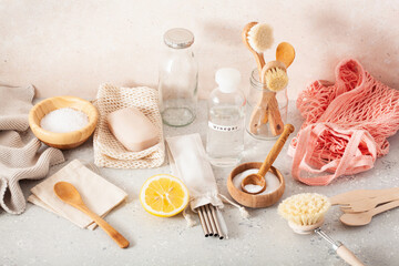 zero waste eco friendly cleaning kitchen concept. wooden brushes, lemon, baking soda, vinegar, drinking straw