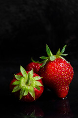 fresh strawberries on a black background