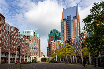 Street view of The Hague city center with the brick made skyscrapers imitating the traditional...