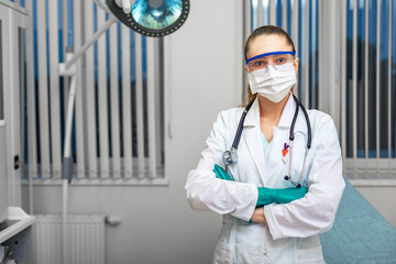 Personal protective equipment, woman doctor in personal protective equipment on the background of a...