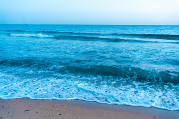 Ocean at dawn natural beach outdoors background.