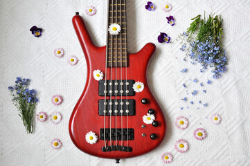 Flowers on a red bass guitar