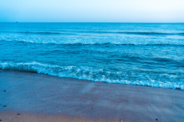 Ocean at dawn natural beach outdoors background.