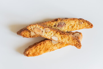 Homemade baked cantucci with almonds on a light background.  Tuscan Biscotti. Traditional cantuccini. Italian sweets biscuits (cookies). Italian coffee dessert.