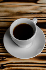 espresso on wooden background with star anise and cinnamon