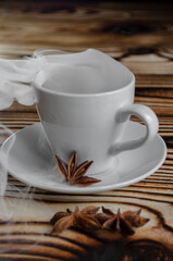 espresso on wooden background with star anise and cinnamon