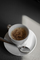 a cup of coffee sprinkled with chocolate chips