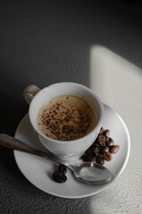 a cup of coffee sprinkled with chocolate chips