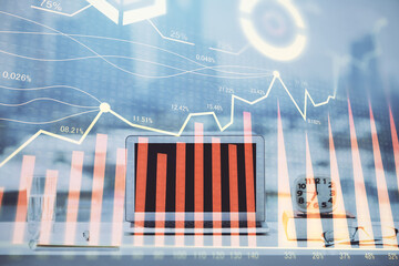 Forex Chart hologram on table with computer background. Multi exposure. Concept of financial markets.