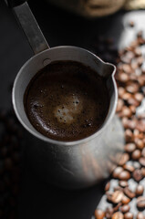 coffee cezve with fresh coffee and beans