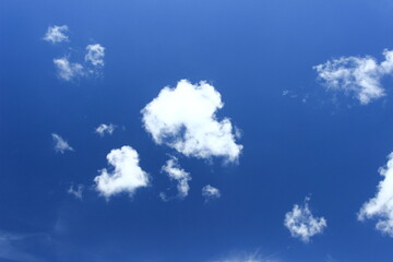 Naklejka na ściany i meble White clouds on blue sky, nice weather condition 