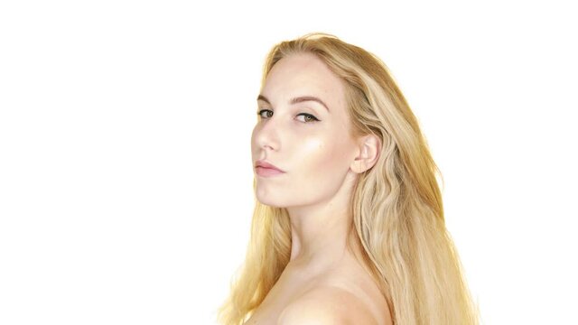 Portrait of a beautiful young sexy woman with long blond hair on white background.