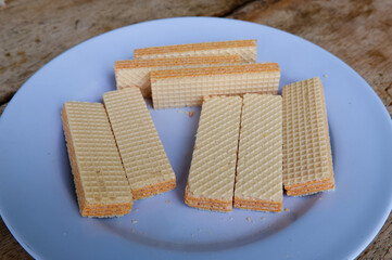 Dessert on a blue plate on a wooden table