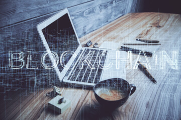 Multi exposure of blockchain and crypto economy theme hologram and table with computer background....