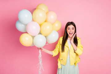 Portrait of astonished positive cheerful girl get many balloons on birthday impressed touch hand face scream wow omg wear good look clothes isolated over pastel color background