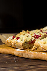 sliced ​​homemade grated pie with berries