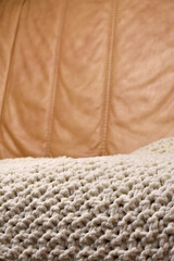 Fototapeta na wymiar knitted pillow and handmade plaid