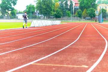 Fototapeta premium legs of a long distance runner.Men runs.Outdoor image