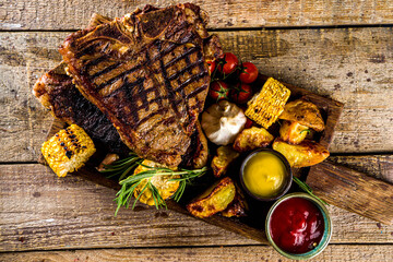 Cooking meat background. Fresh grilled meat  on dark grey table background. Top view. copy space