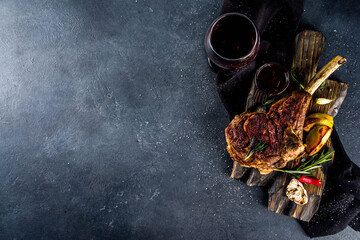 Cooking meat background. Fresh grilled meat  on dark grey table background. Top view. copy space