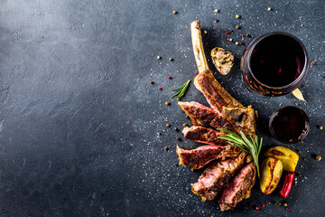 Cooking meat background. Fresh grilled meat  on dark grey table background. Top view. copy space
