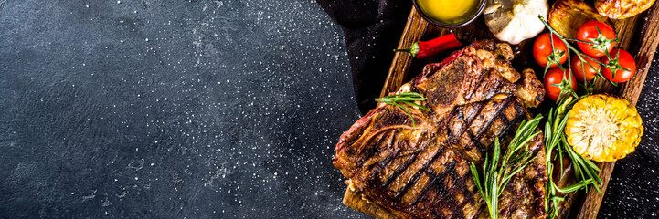 Cooking meat background. Fresh grilled meat  on dark grey table background. Top view. copy space
