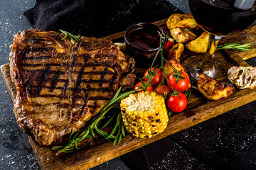 Cooking meat background. Fresh grilled meat  on dark grey table background. Top view. copy space