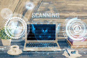 Double exposure of desktop computer and technology theme hologram. Concept of software development.