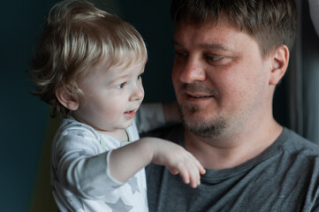  Portrait Of Dad With Son At Home. Dad with one year old son at home