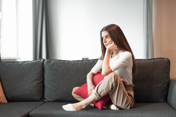 Obraz premium Young woman pretty relaxing on couch in living room