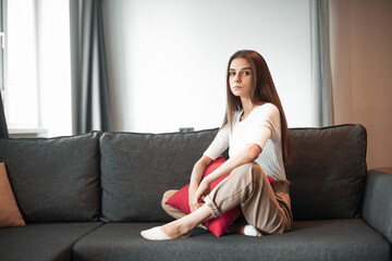 Fototapeta premium Young woman pretty relaxing on couch in living room