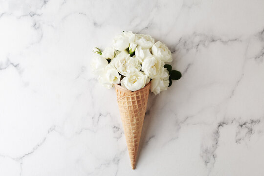 White flowers in ice cream cone