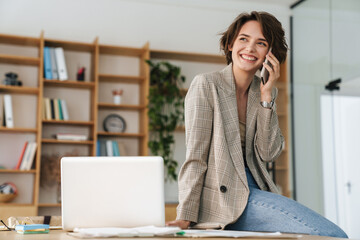 Attractive young businesswoman wearing jacket