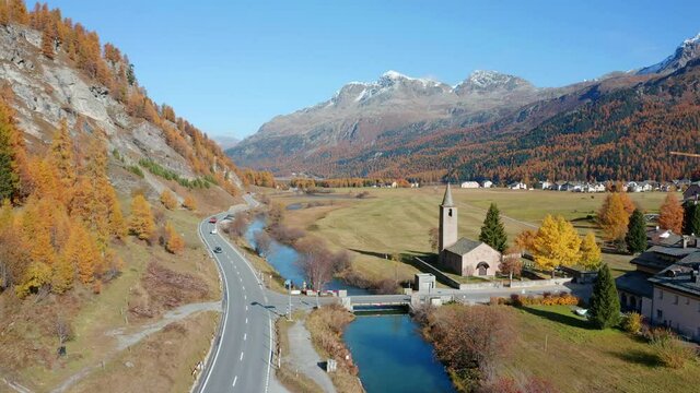 4k drone forward video (Ultra High Definition). San Lurench church in Sils im Engadin village. Captivating morning scene of Swiss Alps, Sils lake, Switzerland, Europe. 
