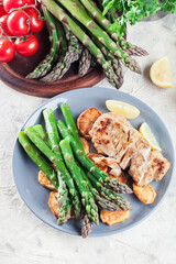 Fried cod fillet with green asparagus