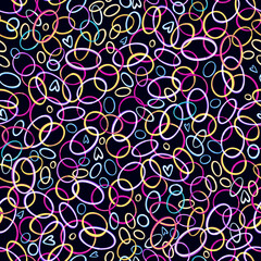 Vivid neon seamless pattern with hand drawn interlacing circles and ovals on a black background