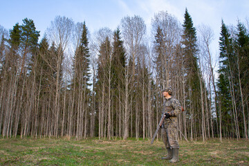 a hunter with an unloaded rifle in his hand