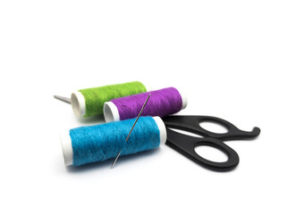 Threads with scissors isolated on a white background