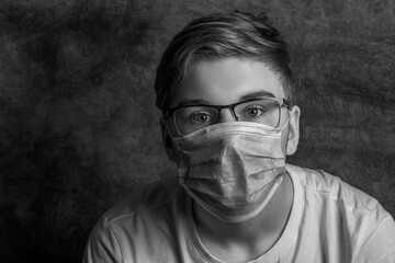 portrait of a boy in a facial mask