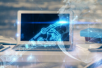 Computer on desktop in office with technology theme hologram. Multi exposure. Tech concept.